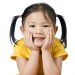 A young asian american girl smiling.