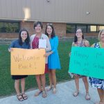 Welcome Back! Happy 1st day of school! (Teachers holding signs)