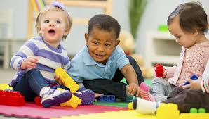 Little kids playing with blocks