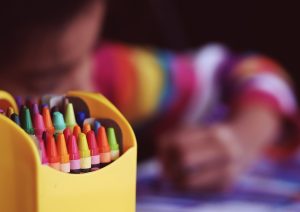 Boy Using Crayons